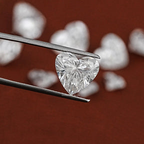 Twijer holding On the Eco Friendly Heart Shape Lab Diamond