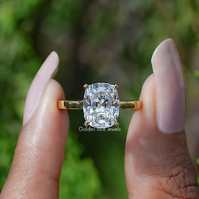 Front View of Elongated Old Cushion Cut Yellow Gold Ring In two Fingers