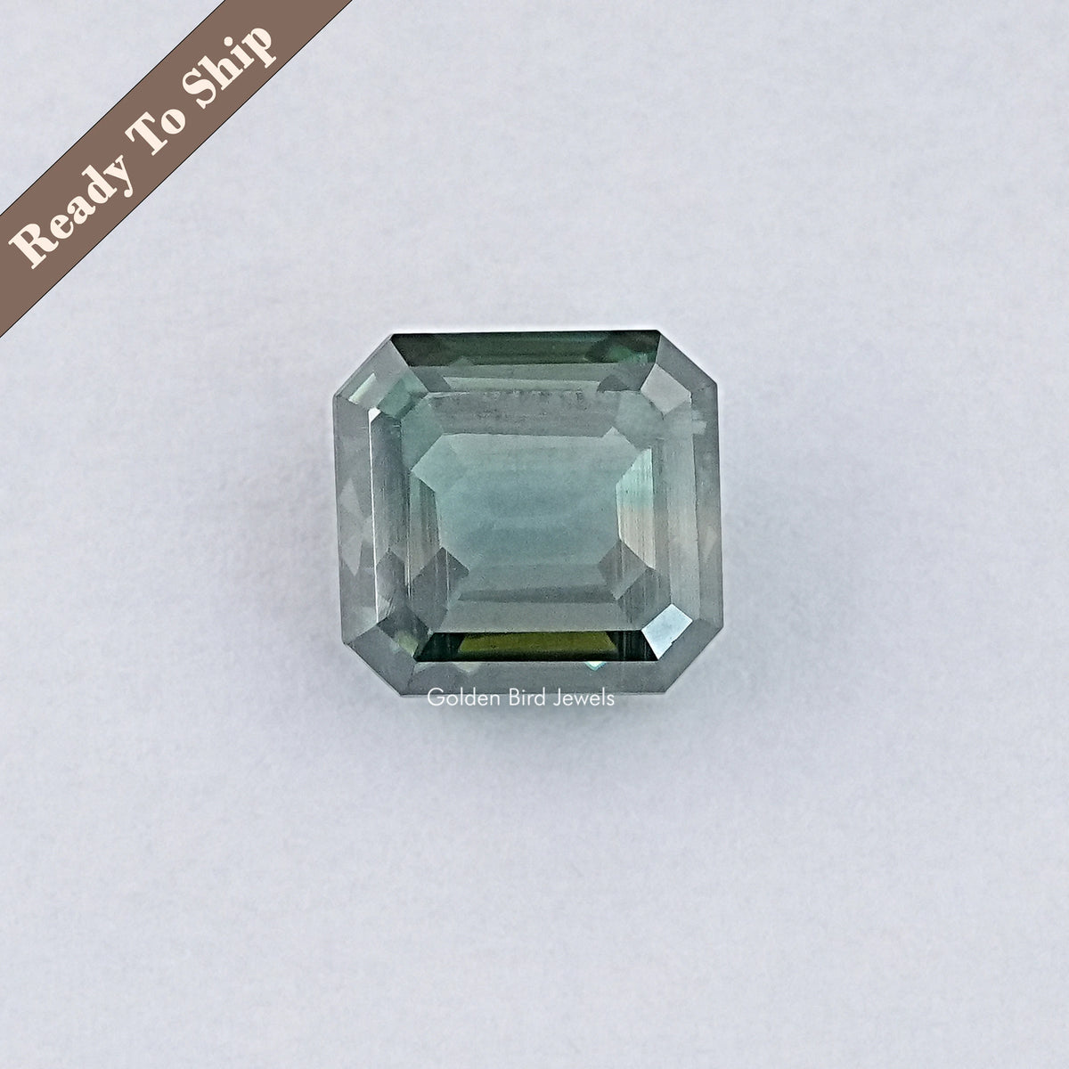 Green emerald-cut moissanite gemstone, rectangular faceted loose stone