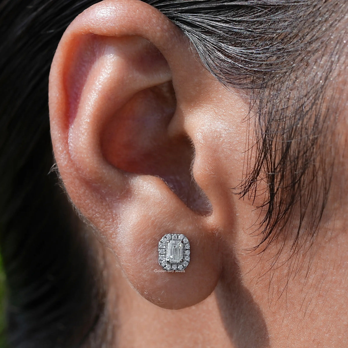 In Ear view of emerald Cut moissanite Stud Earrings