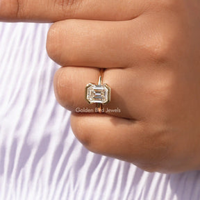 View of Emerald Cut Solitaire Moissanite Engagement Ring In Finger