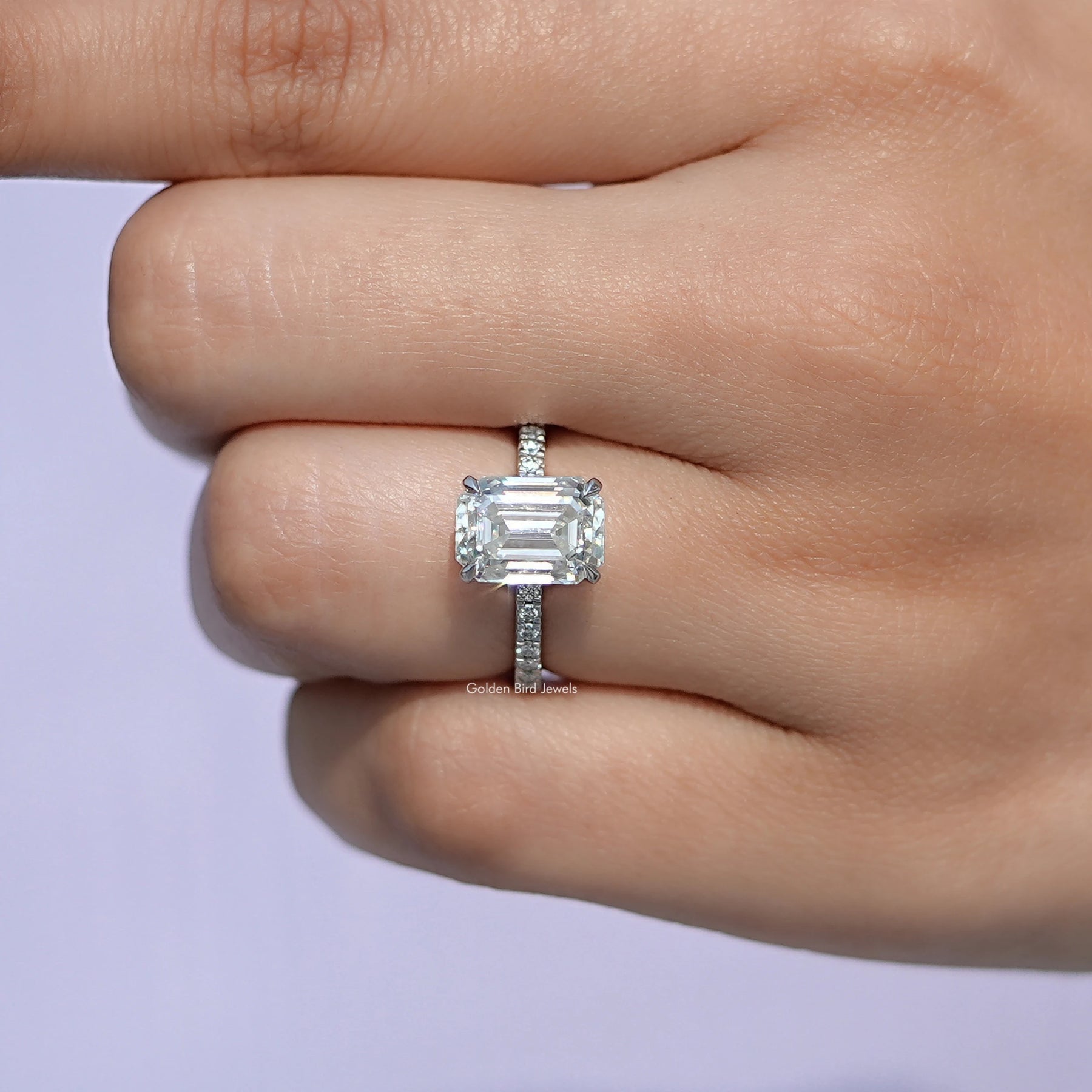 View of Emerald Cut Moissanite Solitaire Ring in prongs setting 