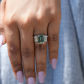 Front View of Emerald Cut Moissanite Three Stone In White Gold