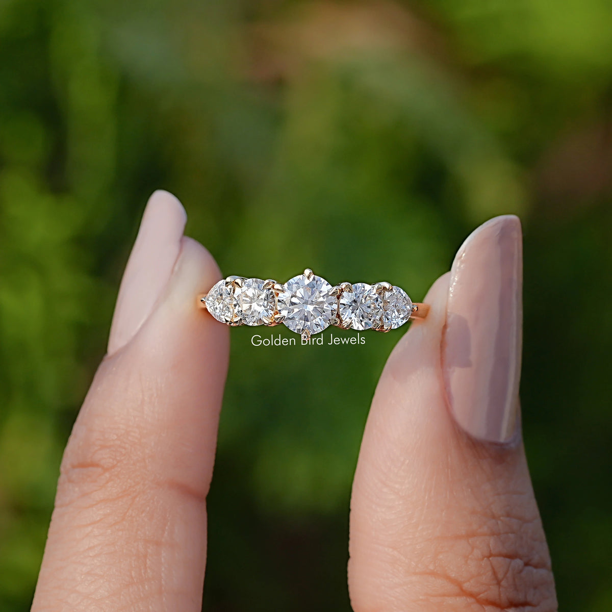 Front View of Five Stone Round And Heart Lab Diamont Ring In two Fingers