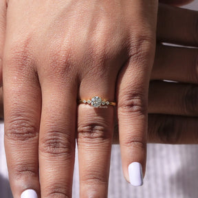 In finger front view of Lab Diamond Round Cut Ring in unique shape