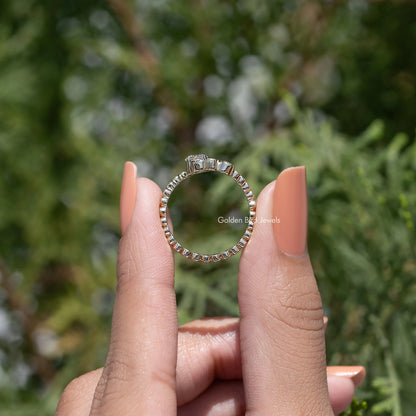 Gold round-cut wave wedding band with full-circle row of small stones, on hand