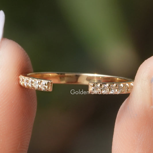 Round Shape Moissanite Open Cuff Engagement Ring Held Between Fingers