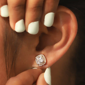 Front view of round cut moissanite stud earrings in  white gold