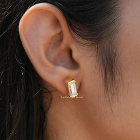 Side view of emerald cut stud earrings for women 