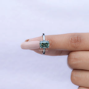 In finger front view of Fancy Green Elongated cushion moissanite hidden halo ring in unique shape