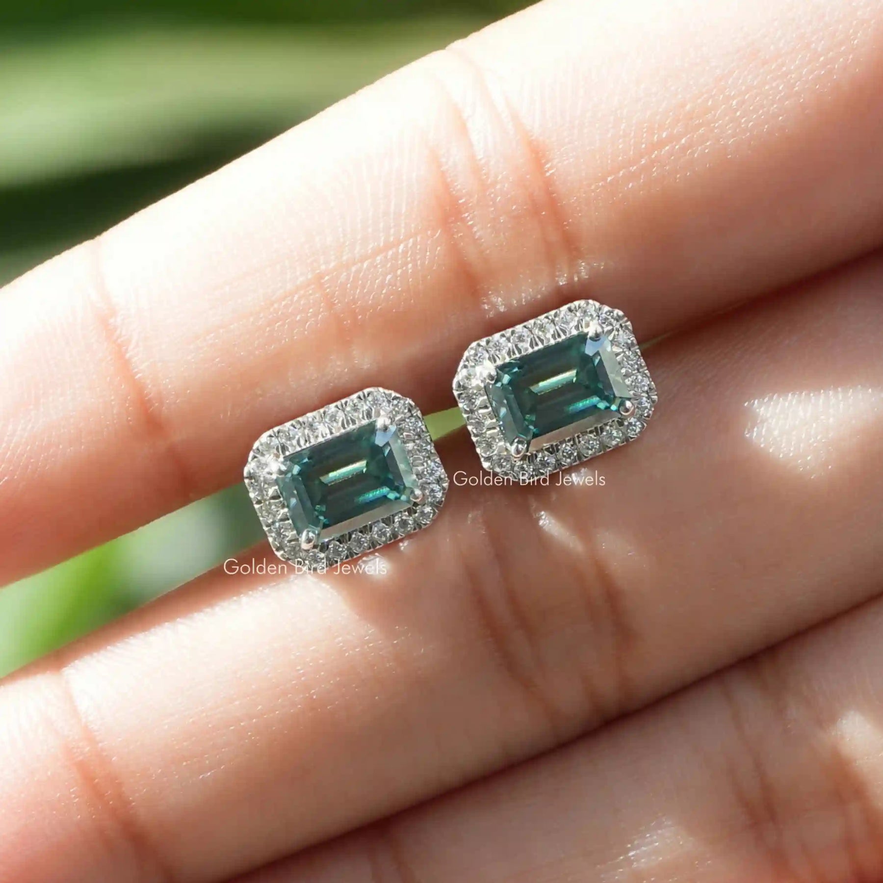 Green emerald cut stud earrings in  vvs clarity