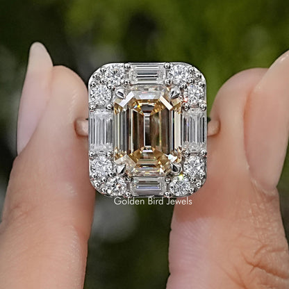 Sterling silver moissanite halo ring with a rectangular center stone and baguette and round accents