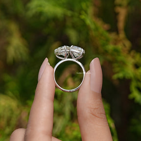 Back View of Heart And Cushion Cut Moissanite Ring In two fingers