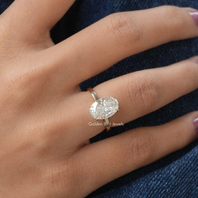 View of Crushed Ice Oval Solitaire Moissanite Ring In Yellow Gold
