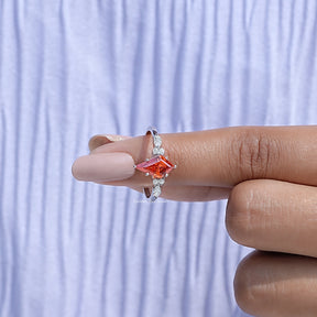 In finger front View of Kite Cut Gemstone Accent Engagement Ring In White Gold