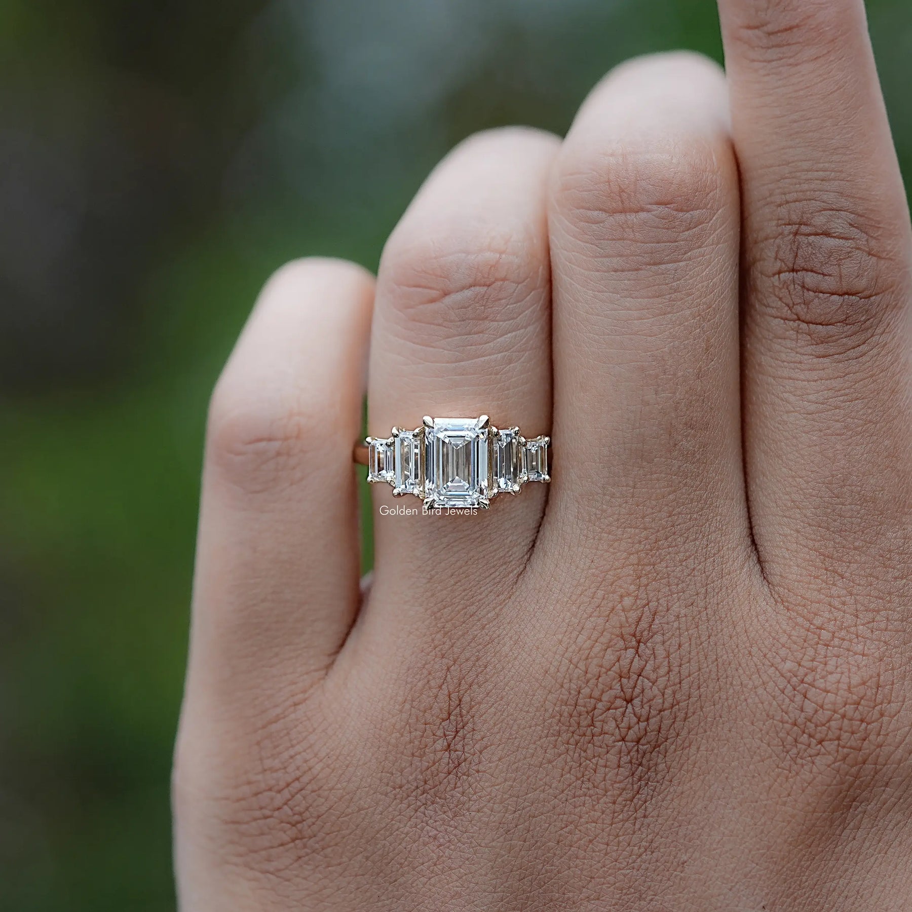 Front view of Emerald And Baguette Diamond Five Stone Ring