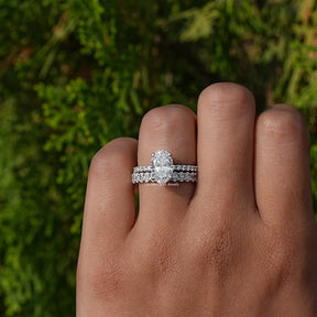 Oval Cut Lab Diamond Bridal Ring Set on a finger, front view