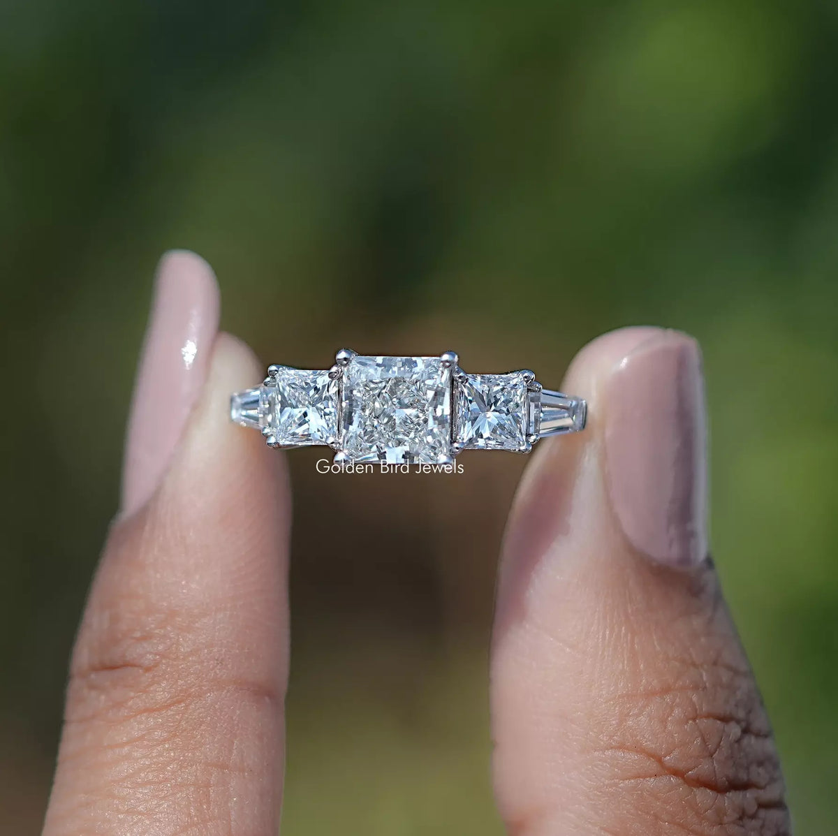 Front View of Princess Cut Lab Diamond Five Stone Ring In two Fingers