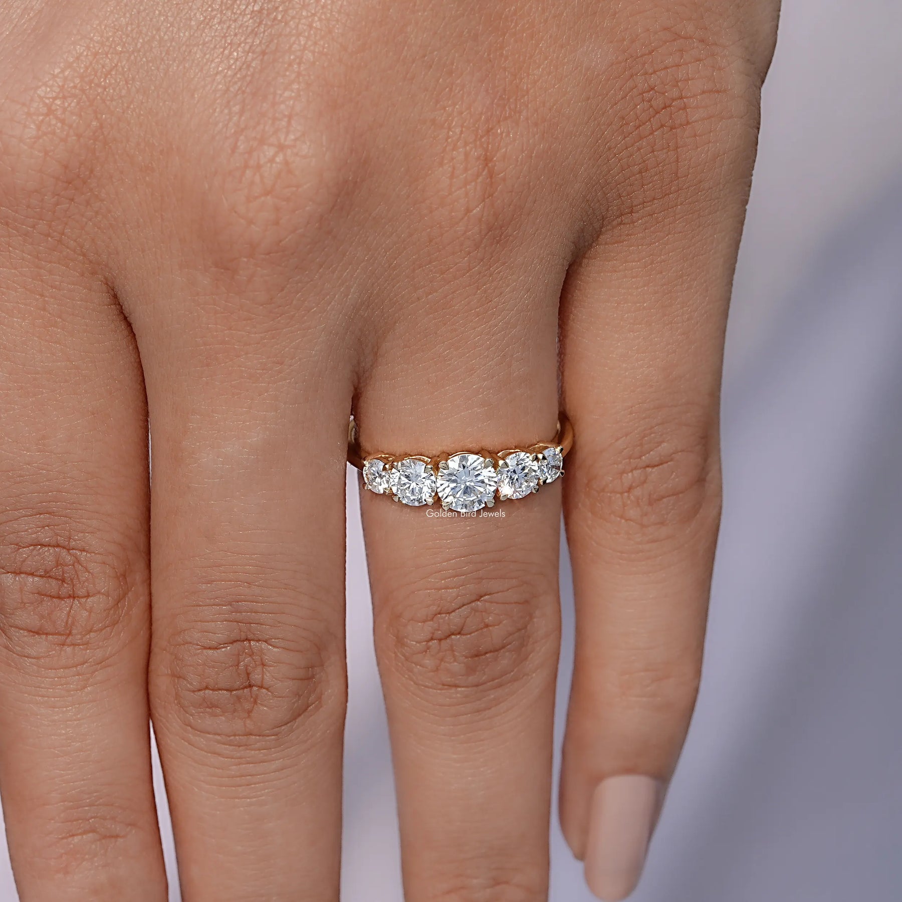 View of Round Cut Diamond Five Stone Accent Ring In Finger 