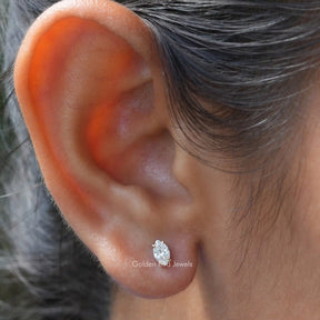 In ear front view of lab grown marquise cut stud earrings