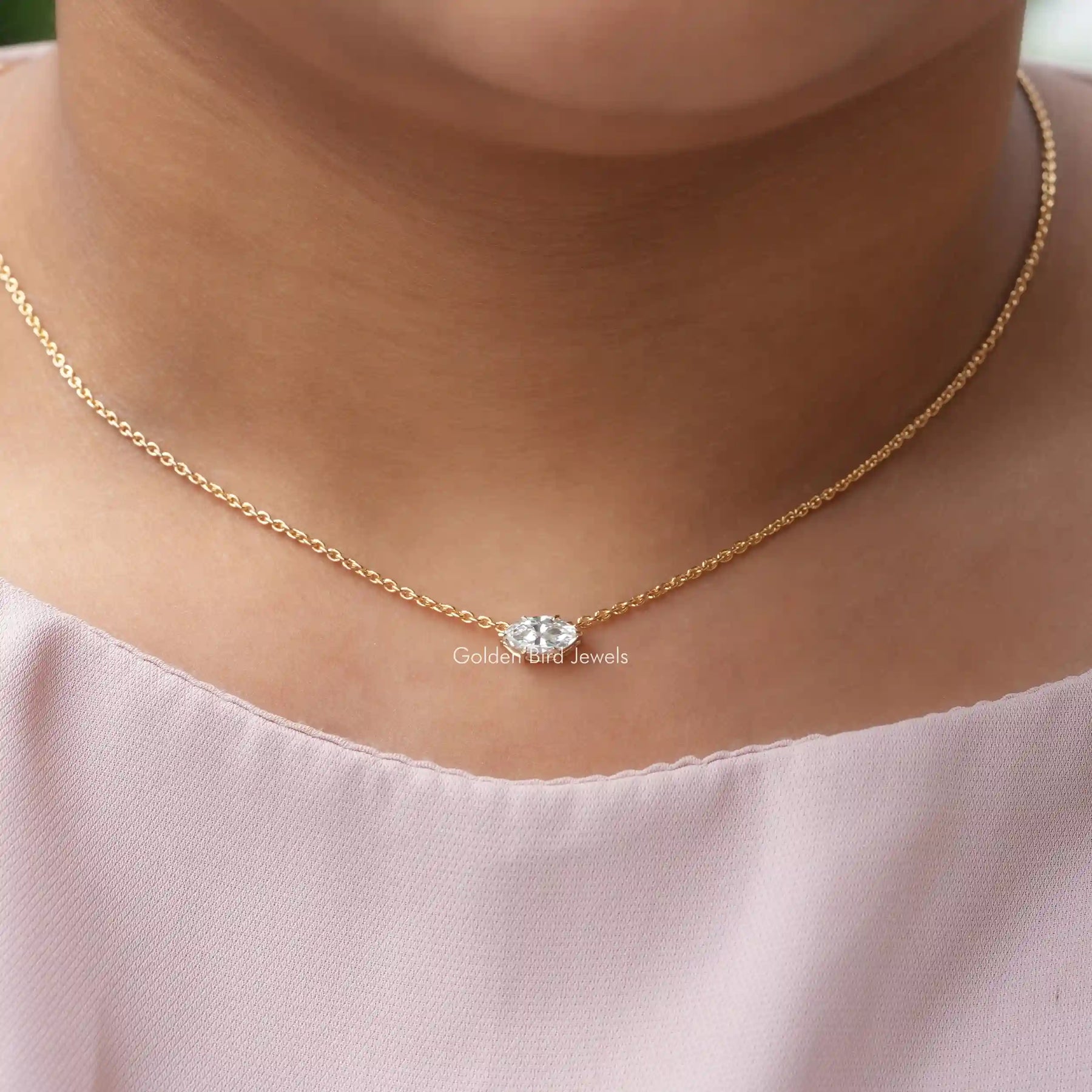 In neck front view of lab-grown diamond marquise solitaire pendant