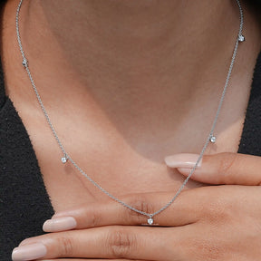 Close-Up View of Round Cut Diamond Station Necklace In White Gold