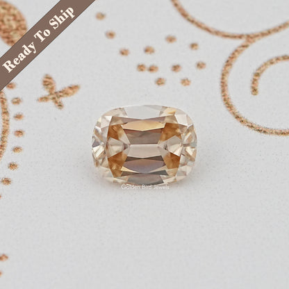 Cushion-cut yellow loose gemstone, faceted with a radiant center