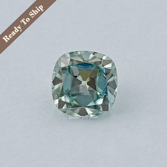 Light blue cushion-cut moissanite gemstone, faceted oval