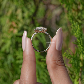 Back View of Marquise Cut Diamond Halo Engagement Ring In two fingers