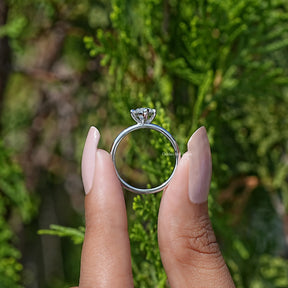 Back View A Marquise Cut  Diamond Solitare Ring In two Fingers