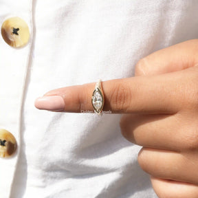 In finger Close view of bezel set with moissanite  ring 