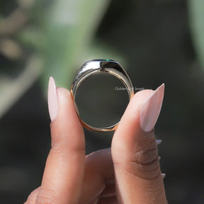 Back View of Moissanite Marquise Bezel Set Ring In two fingers