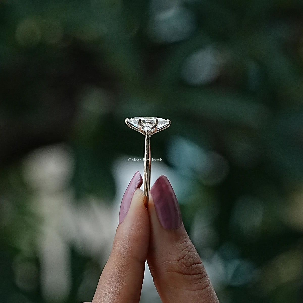 Side View of Marquise Cut Moissanite Three Stone Ring In finger