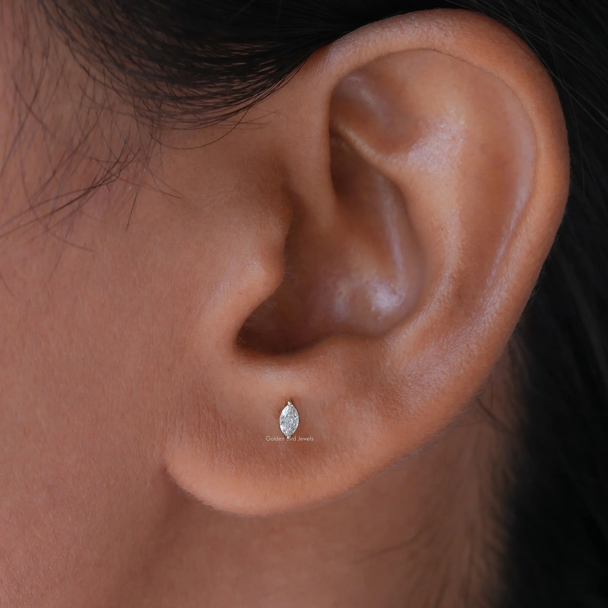 In Ear View Of Marquise Cut Diamond Cut Stud Earrings