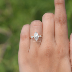 In finger front view of Marquise Cut Moissanite Three Stone Ring