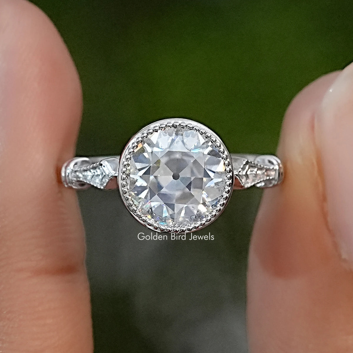 Sterling silver engagement ring with a round old European cut stone and milgrain bezel