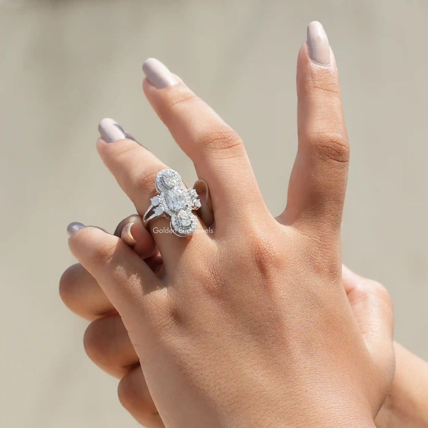 View of Old Mine Cushion And Pear Cut Moissanite Engagement Ring In Finger