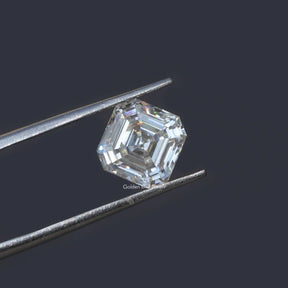 Tweezer holding the Colorless Asscher Cut Loose Moissanite