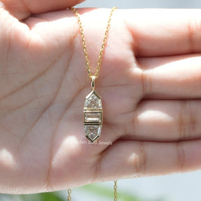 In hand showing view of moissanite pendant	 		