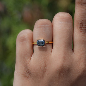 In finger view of East West Cut Moissanite Solitaire Ring