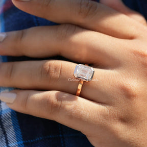 Detailed View Of Moissanite Emerald Cut Solitaire Ring In Yellow Gold