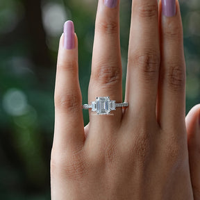 View of Emerald Cut Three Stone Engagement Ring In White Gold