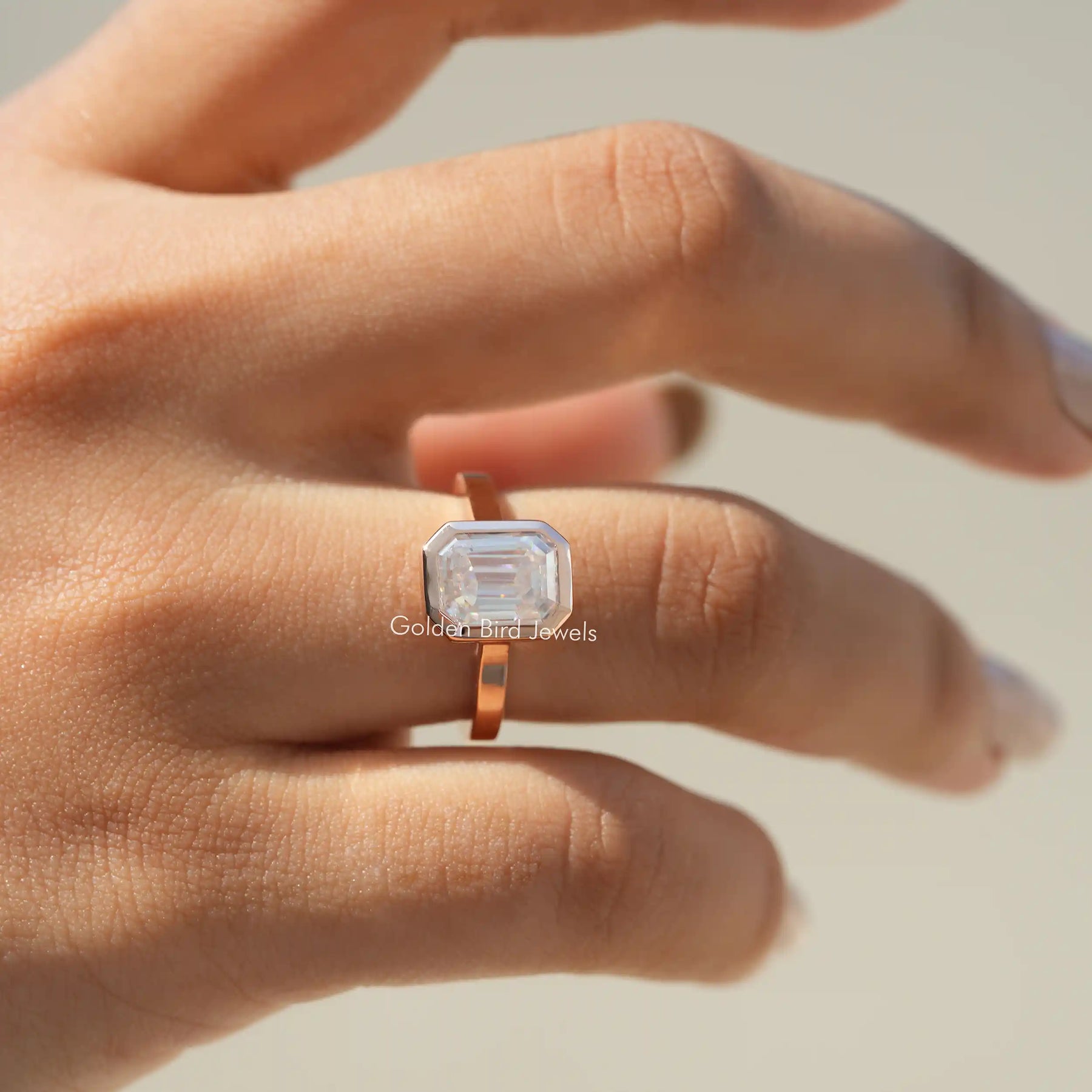View of Emerald Cut Moissanite Engagement Ring In Finger