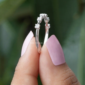Side View of Half Eternity Moissanite Eternity Wedding Band In two fingers