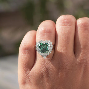 Close-Up View of Green Heart Shaped Moissanite Engagement Ring In Yellow Gold       