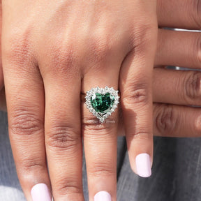 Detailed View Of Heart And Round Cut Halo Moissanite Ring In Yellow Gold
