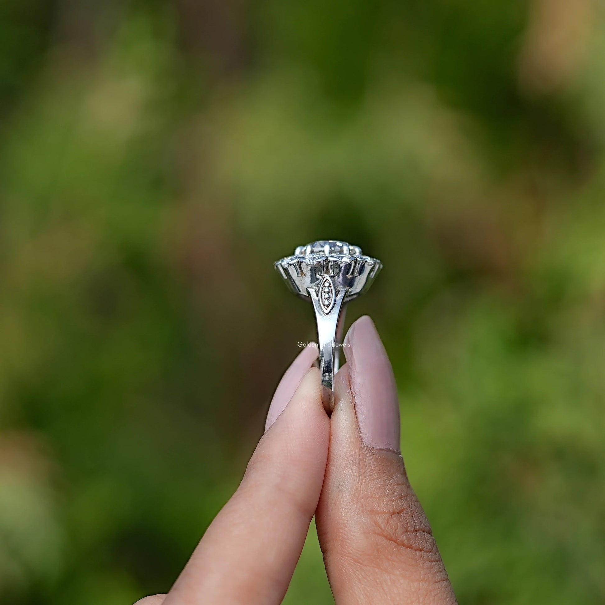 Side View of Old European Round Cut Halo Ring In two fingers