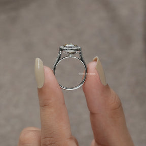 Back View of Bezel Set Cushion Cut Moissanite Ring In two fingers