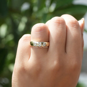 In hand showing a view of moissanite Ring	 		