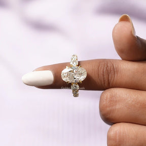 In finger front View of Oval Cut Solitaire Accent Stone Ring